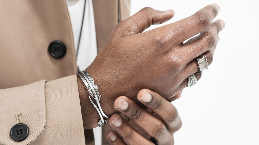 men wearing jewelry closeup bracelet and rings