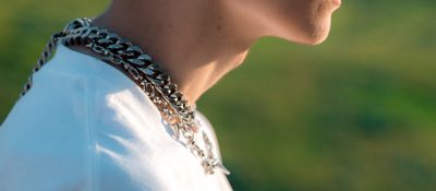 different necklace chain link styles on a man profile