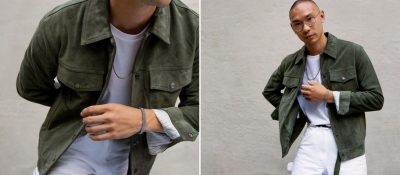 asian man wearing bracelet and necklace from mejuri in green jacket and white shirt and pants