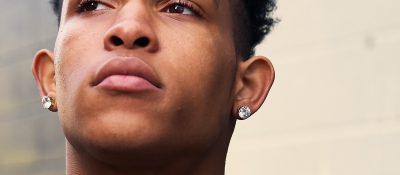 man wearing diamond earrings