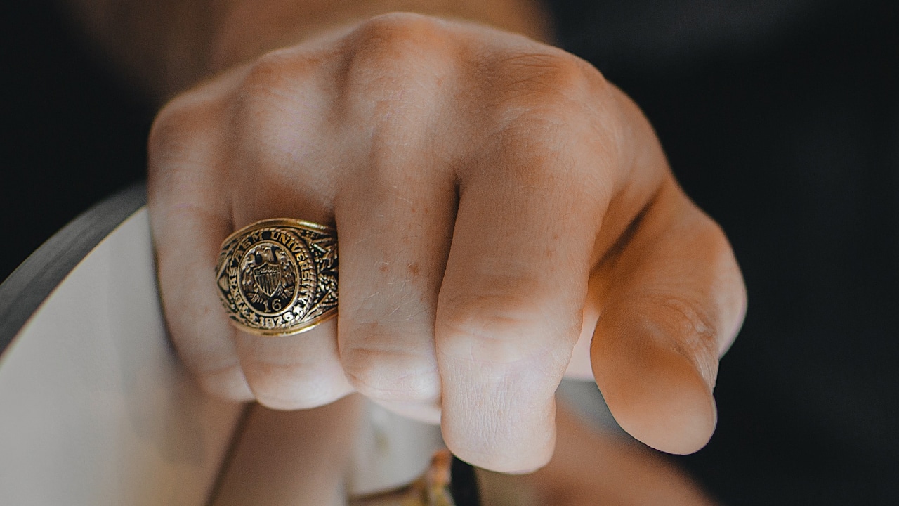 close up of class ring on hand