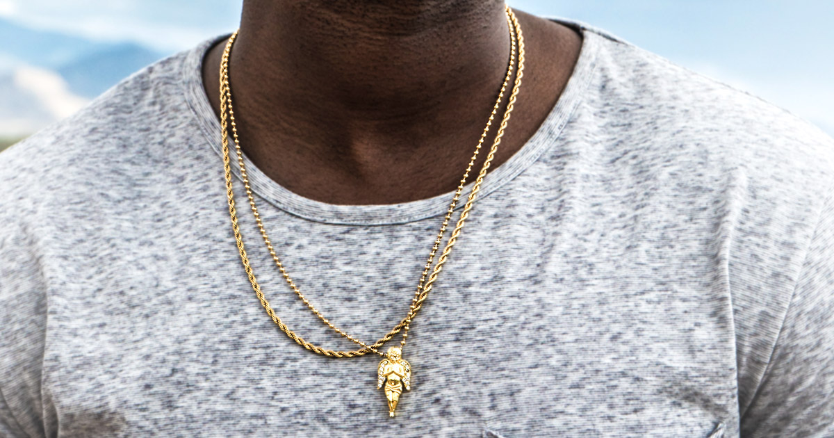 closeup of man wearing gold chain necklace