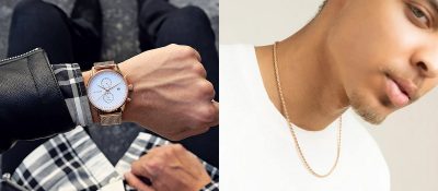 photo of man's watch on wrist and man wearing rose gold necklace