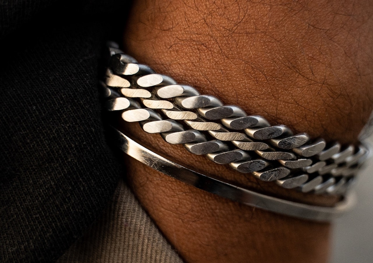closeup stack of silver bracelets