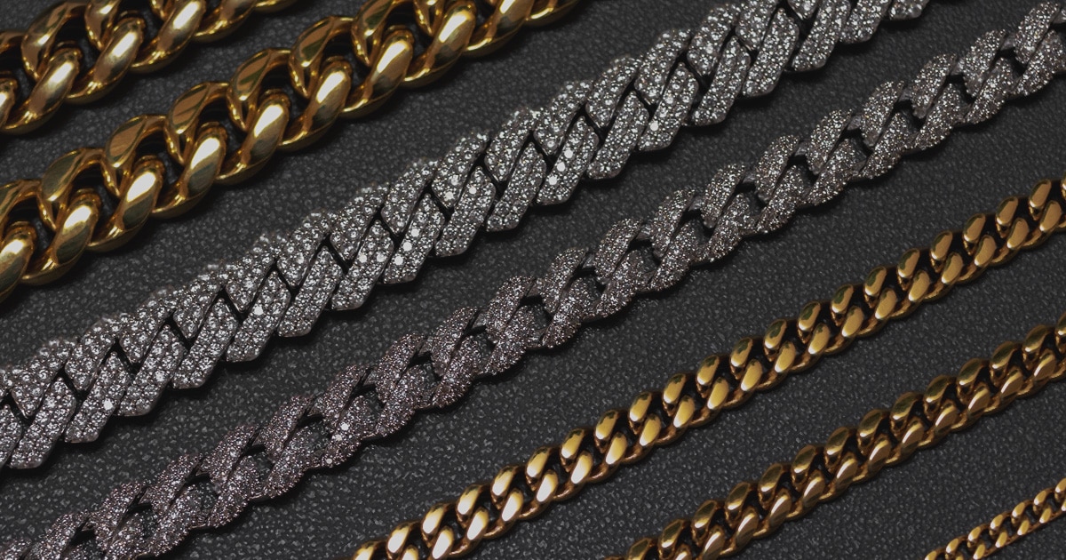 closeup of chain necklaces in white and yellow gold some with diamonds