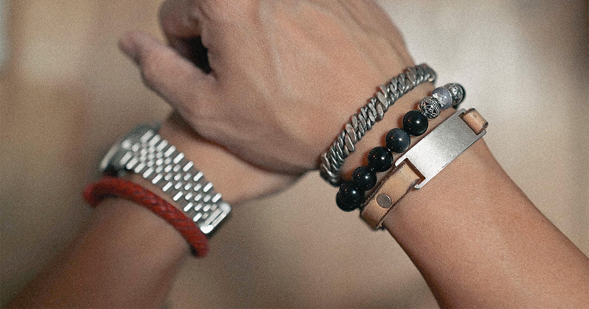badass men's bracelets like a leather ID bracelet, beaded bracelet, and metal cuff